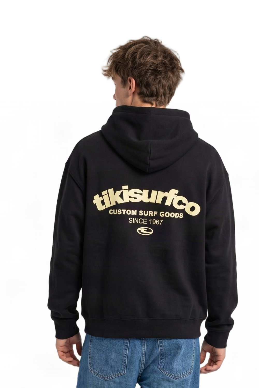 A person shown from the back wearing a black hoodie with a large cream-colored 'tikisurfco' logo printed across the back, paired with blue jeans, against a plain white background.