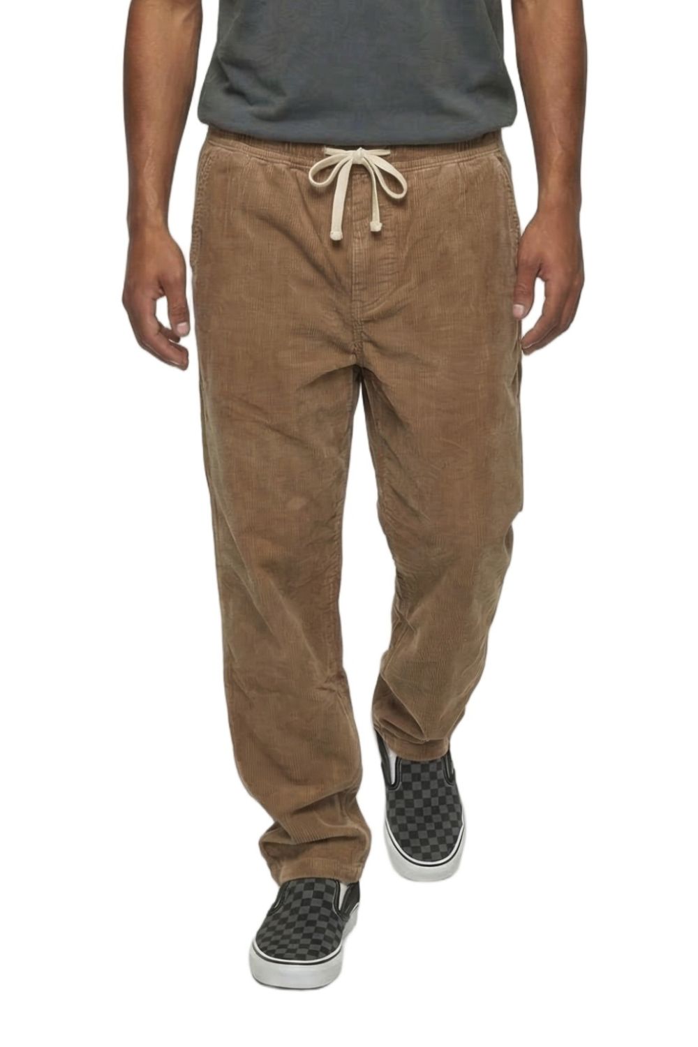 Person wearing brown corduroy pants and black sneakers on a white background
