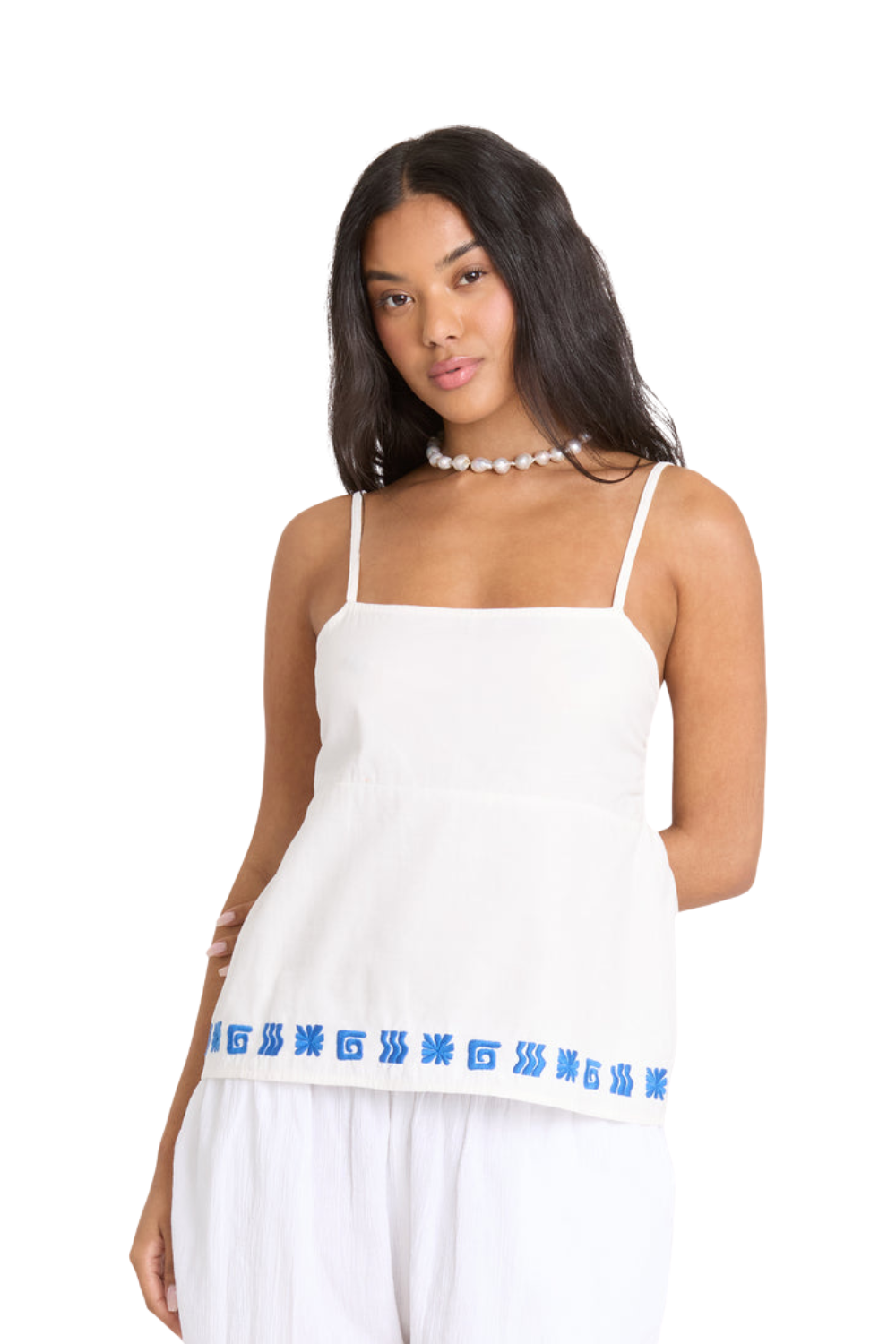 Woman wearing a white tank top with blue text on a white background
