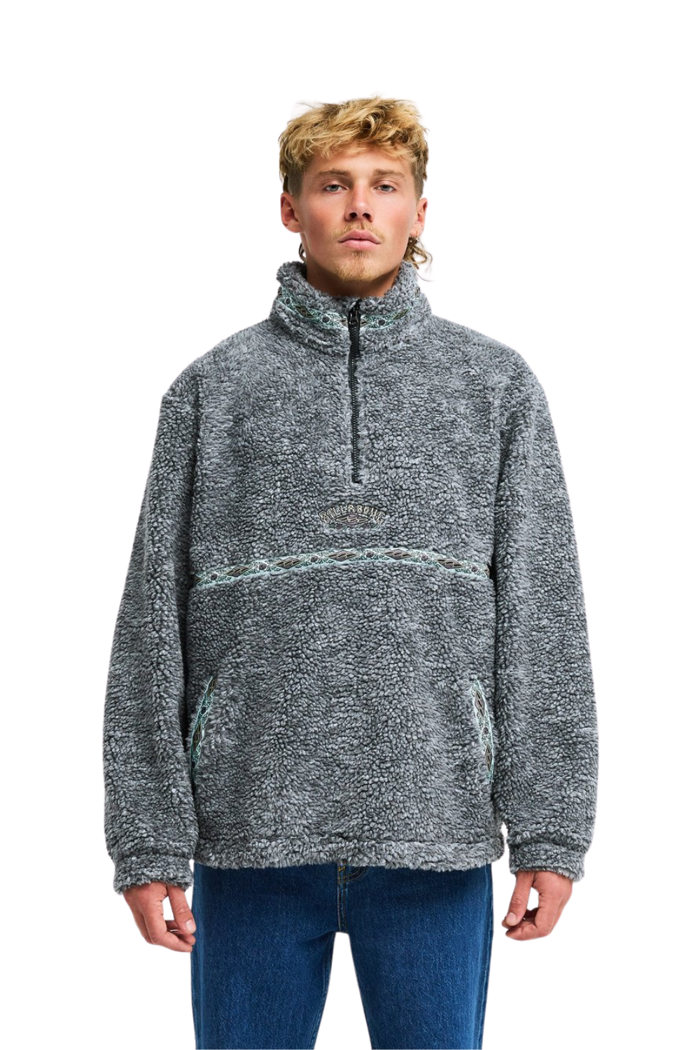 A man wearing a gray marled quarter-zip fleece pullover sweater with a high collar and pockets, paired with blue jeans, against a plain white background.