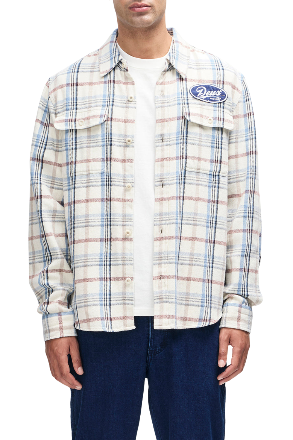 Person wearing a plaid shirt with a brand logo on a white background
