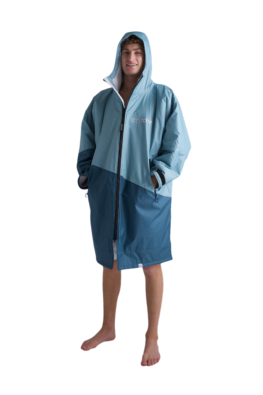 Person wearing a blue Dryrobe with a hood on a white background