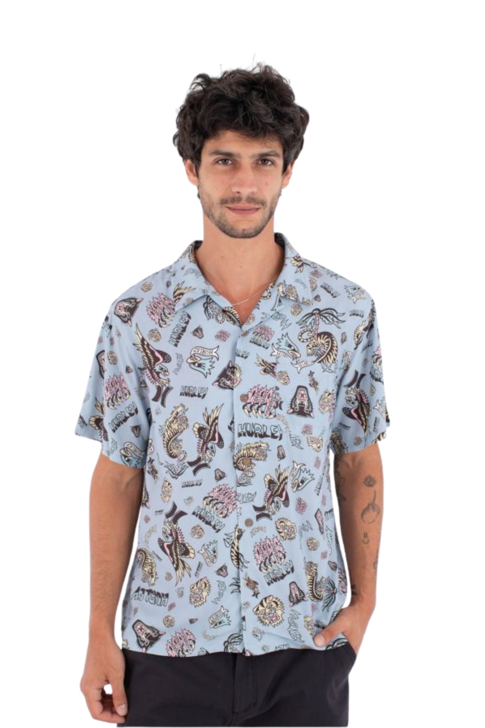 Man wearing a patterned shirt on a white background