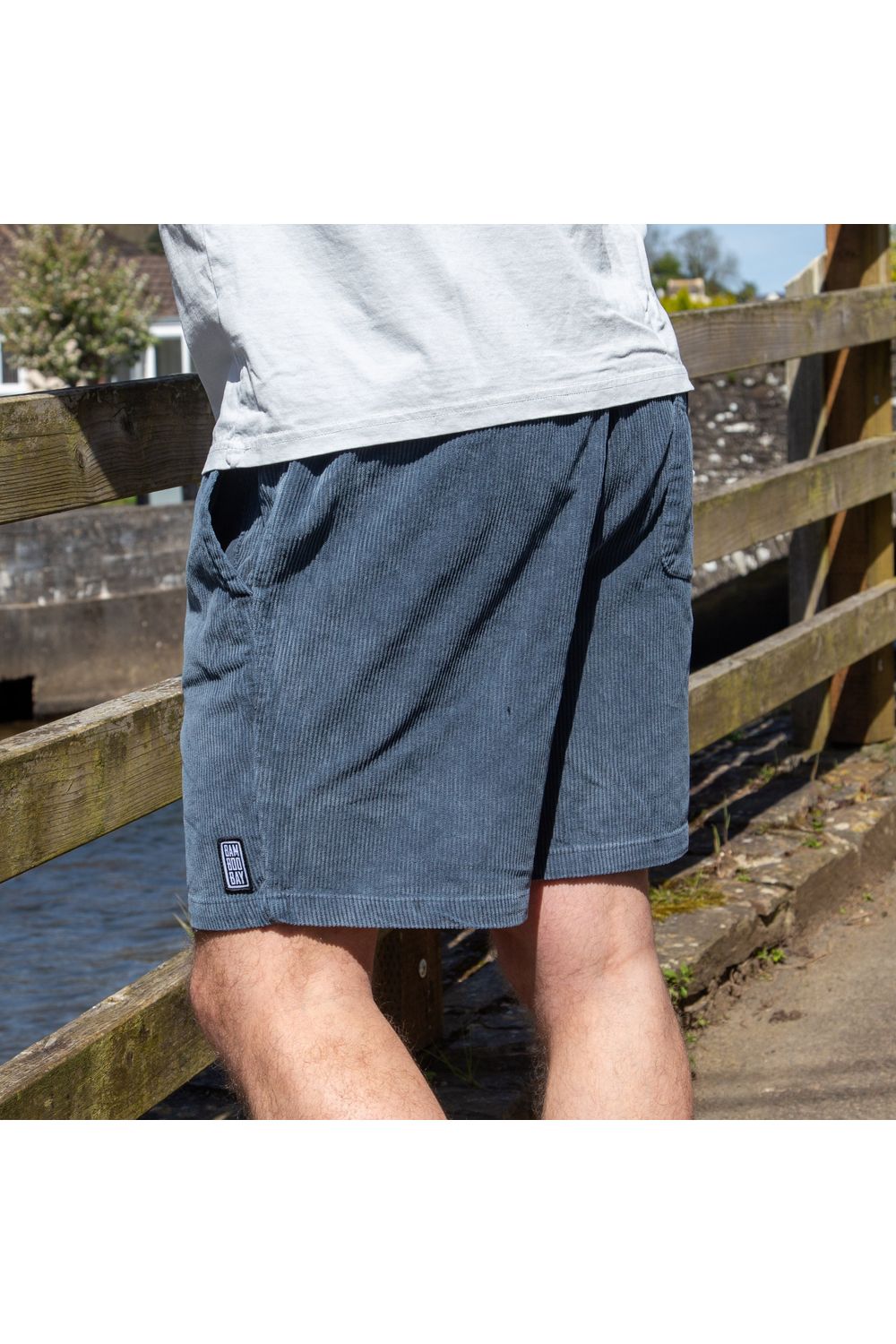 Bamboobay navy cord shorts side view on a model