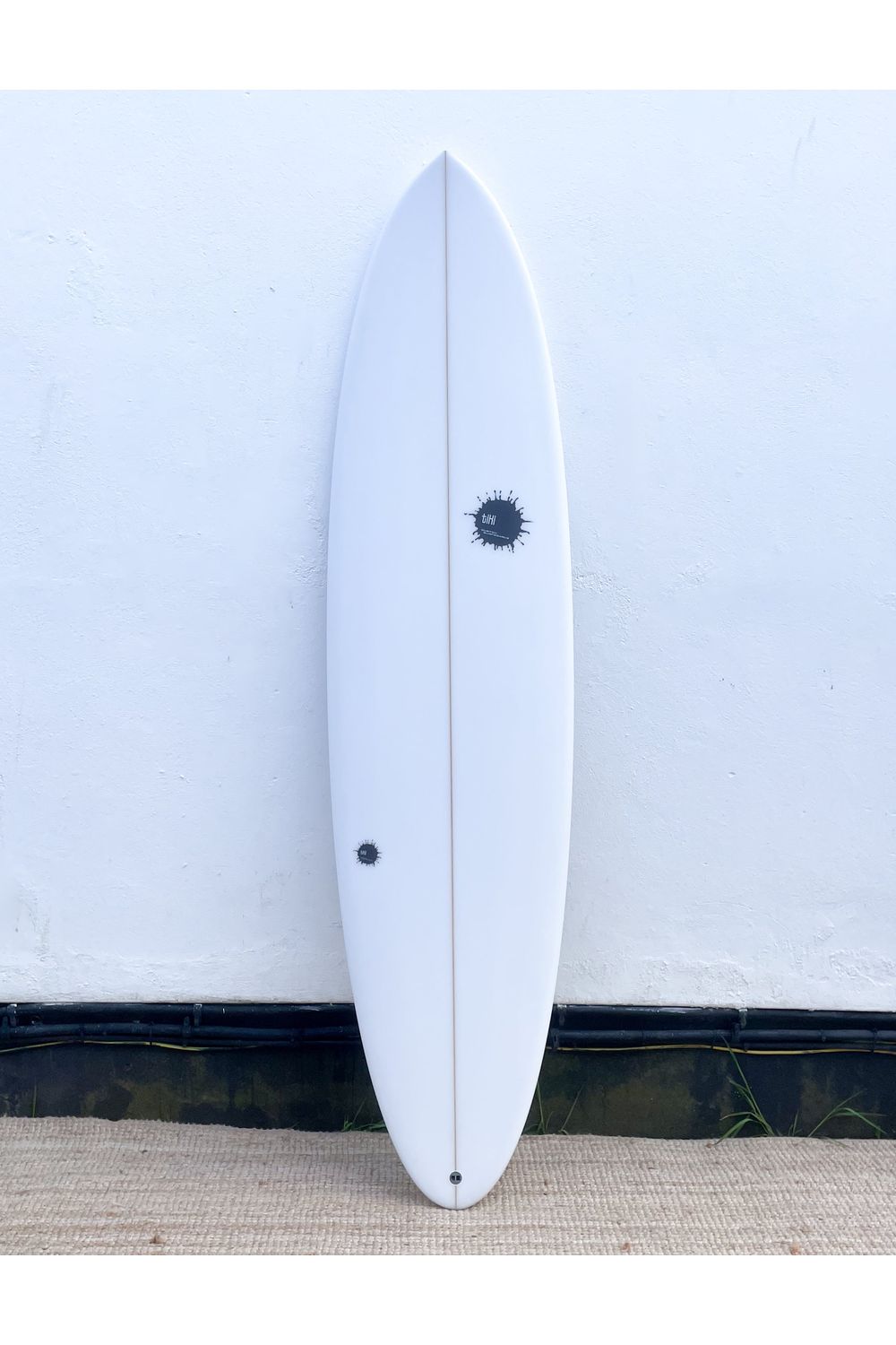 Image of Tiki Custom Surfboard - 7'0 Nomad Mid - Clear from the front