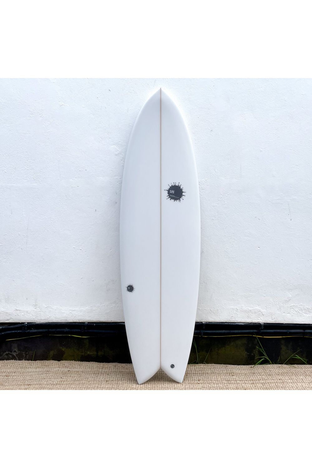 Image of Tiki Custom Surfboard - 6'2 Parrot Twin - Clear from the front