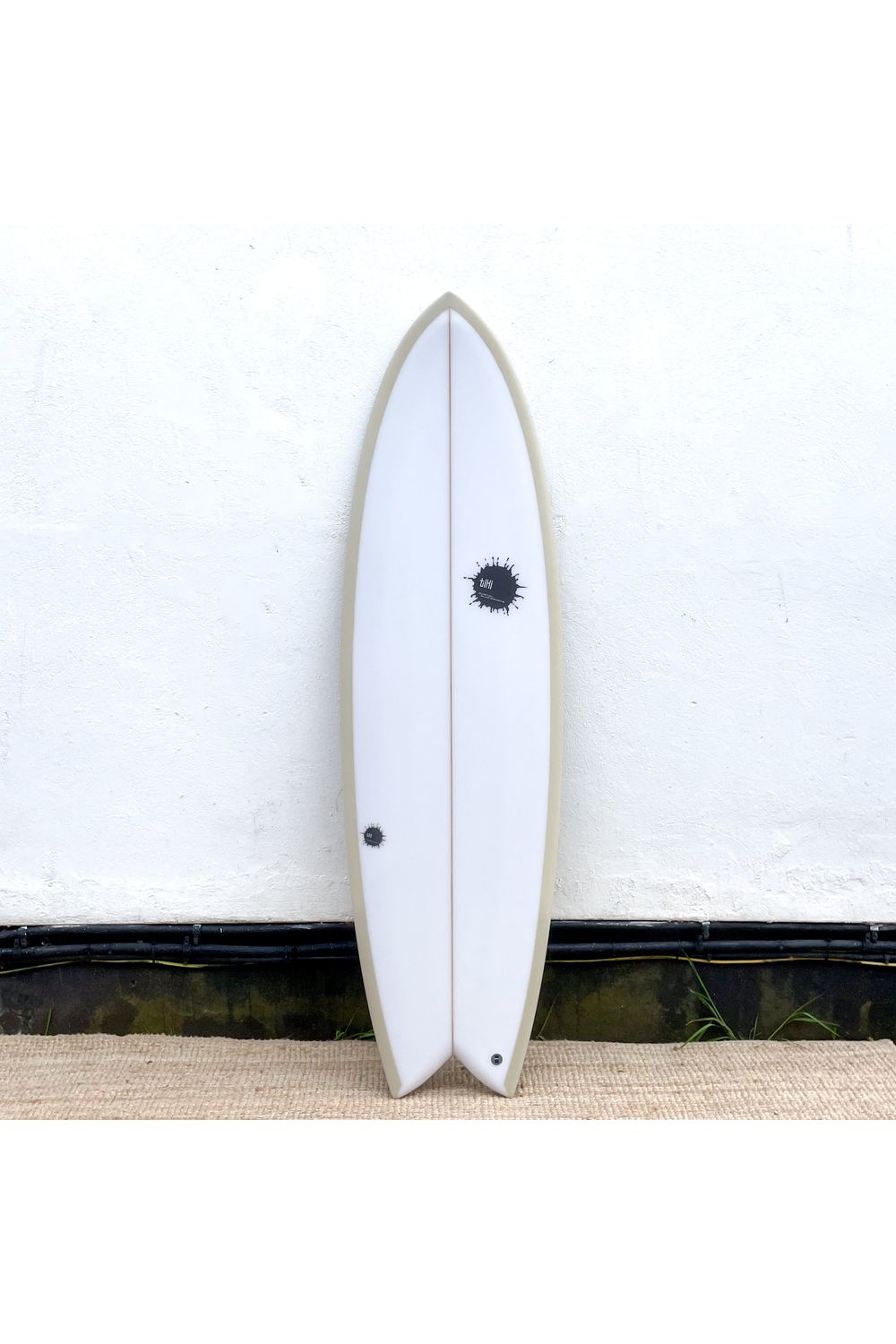 Image of Tiki Custom Surfboard - 5'10 Parrot Twin from the front