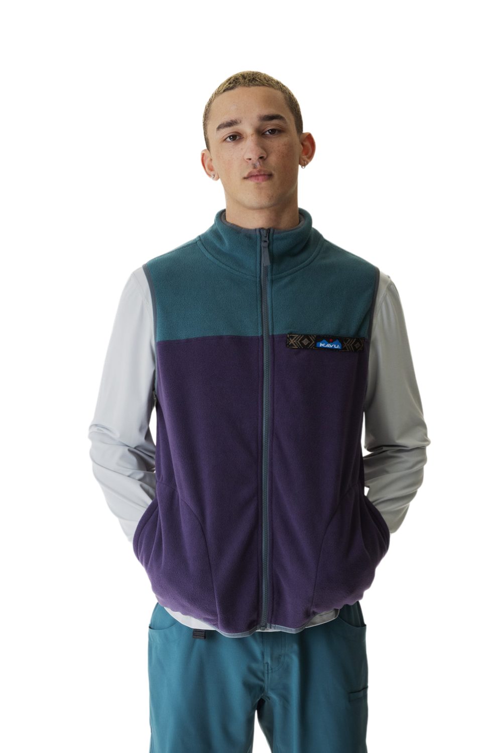 Person wearing a purple and teal vest with a visible brand logo on a white background
