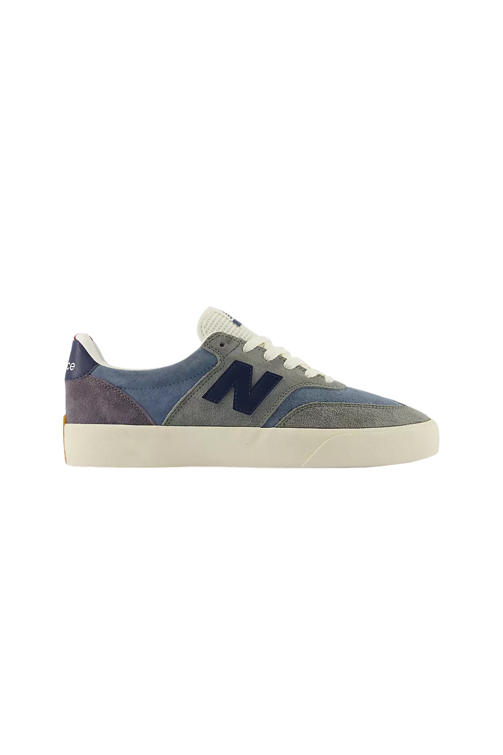 A New Balance low-top sneaker in a mix of blue suede, gray canvas, and dark purple leather panels, featuring a dark blue 'N' logo on the side, white laces, and a thick cream-colored rubber sole.