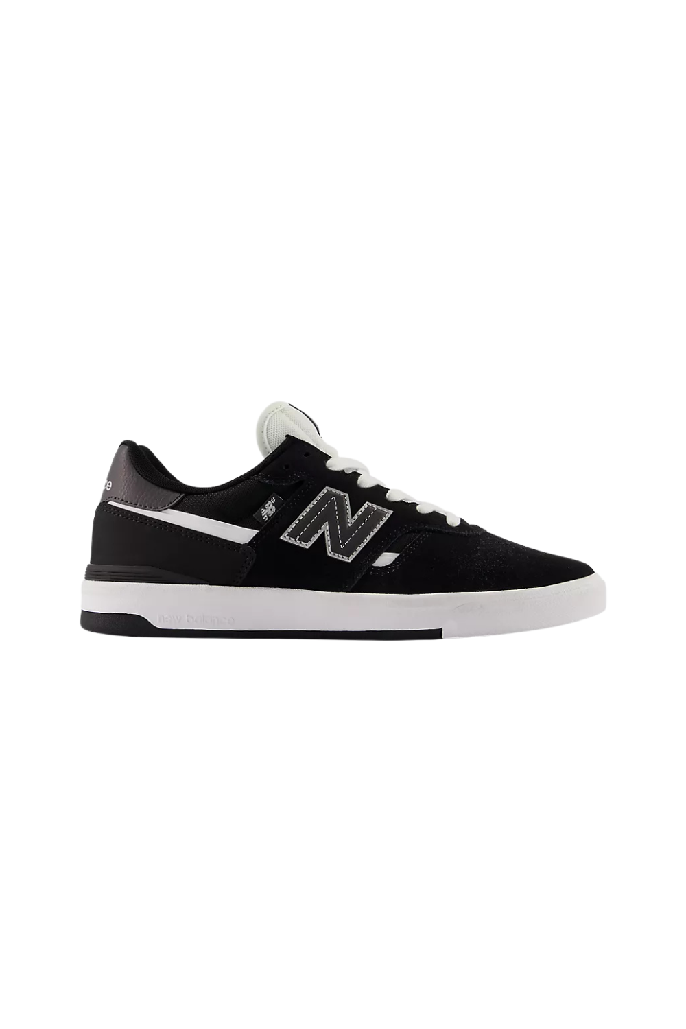 Black New Balance sneaker with white sole and green heel on a white background