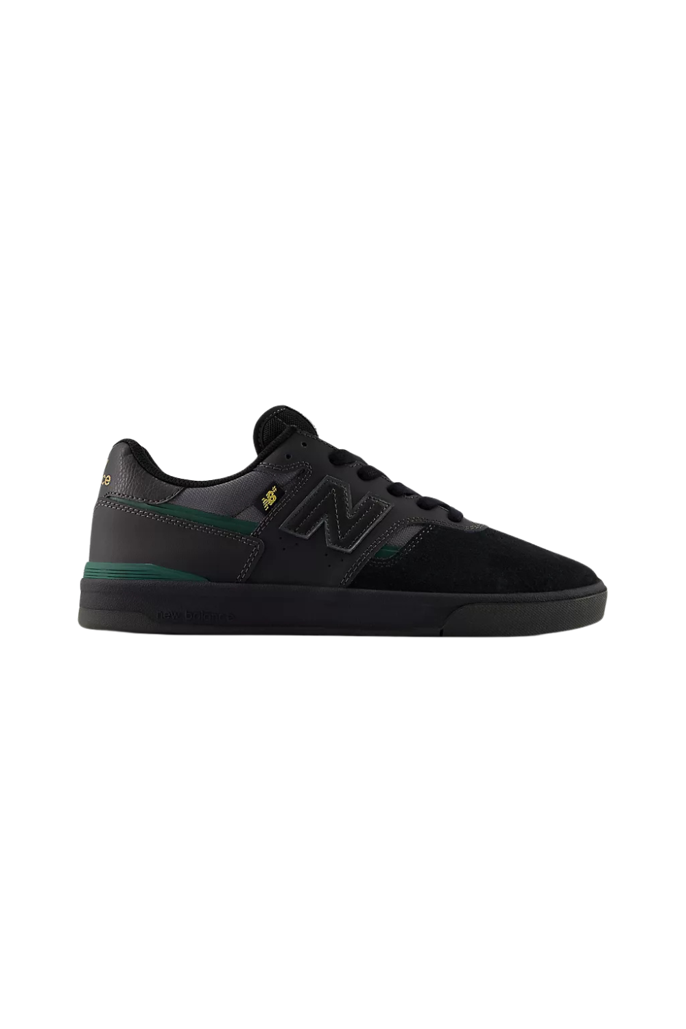 Black New Balance sneaker with green details