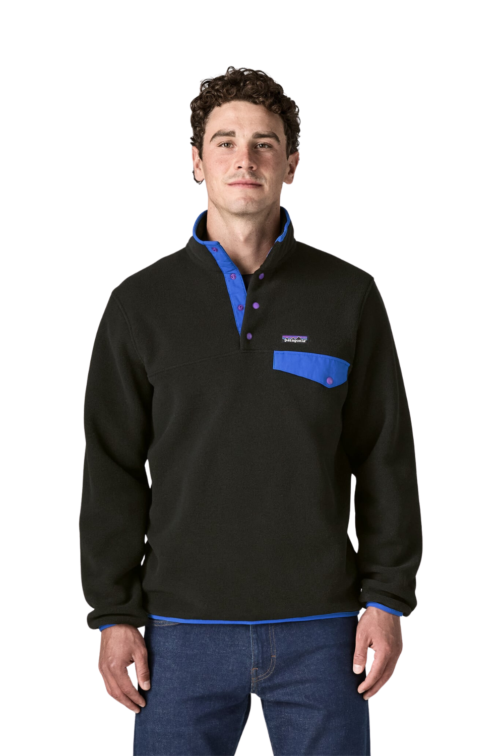 A man wearing a black Patagonia quarter-zip fleece pullover with bright blue accents on the collar, inner placket, and chest pocket, paired with blue jeans against a white background.