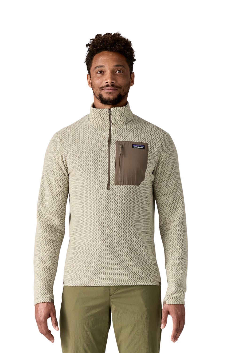 Man wearing a beige patterned pullover with a brown pocket and Patagonia logo on a white background