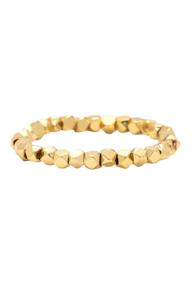 A stretchy gold-colored beaded ring designed to fit on any finger size, showcasing a faceted bead pattern.