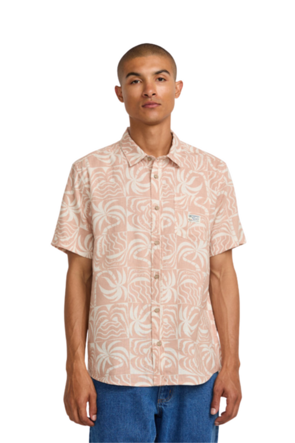 Man wearing a patterned short-sleeve shirt on a white background