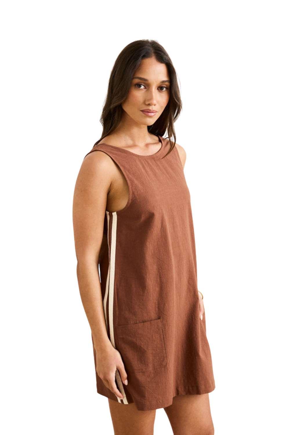 Woman wearing a brown sleeveless dress with white stripes on a white background