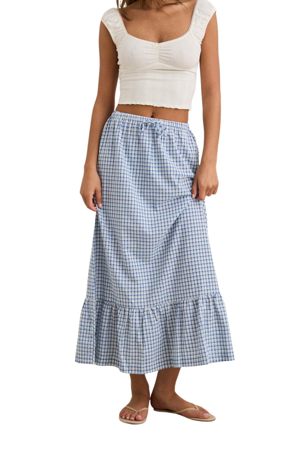 Woman wearing a white top and blue checkered skirt on a white background