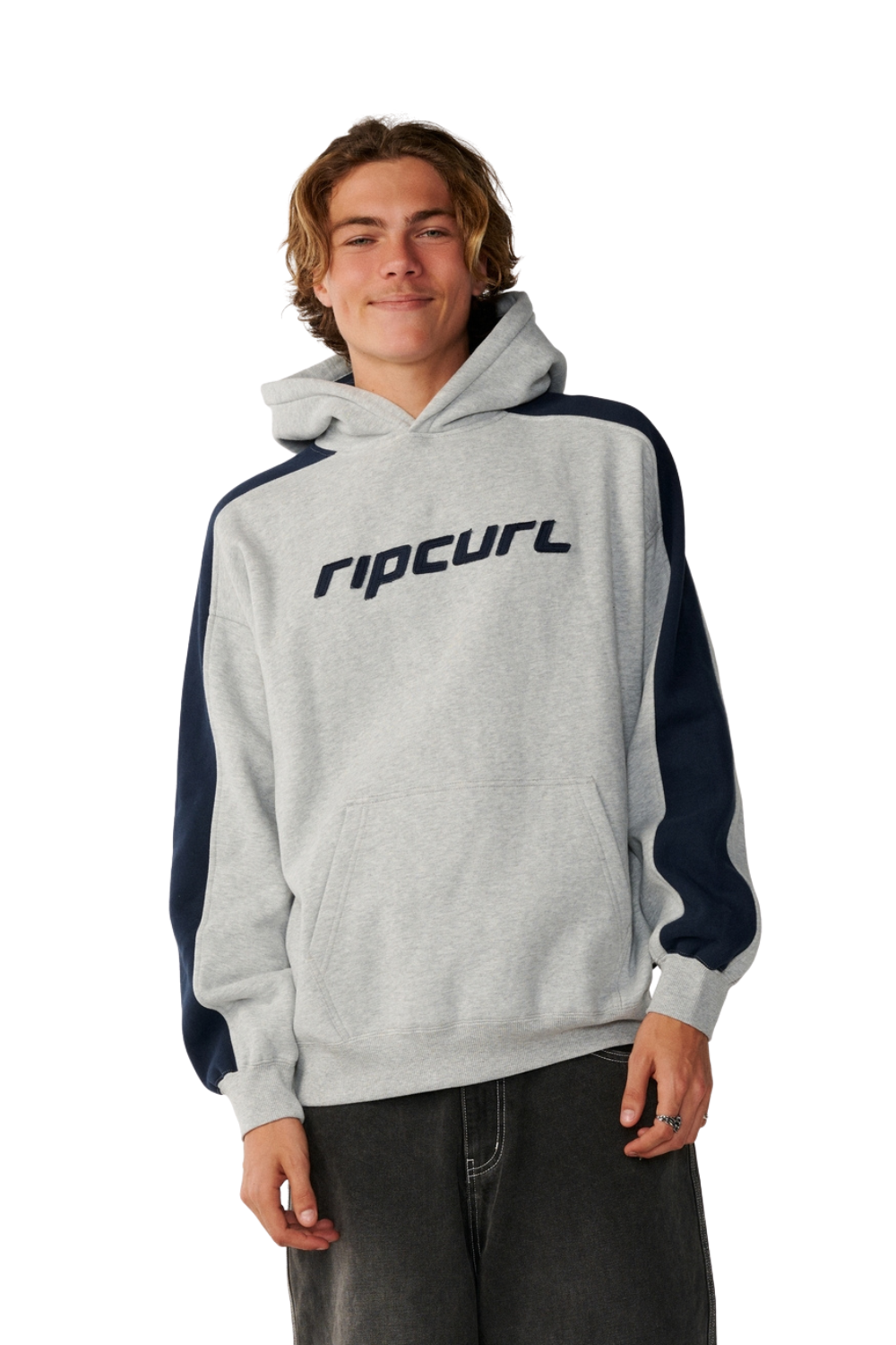 A man wearing a Rip Curl colorblock hoodie in light gray and black, featuring the brand name printed across the chest, set against a plain white background.