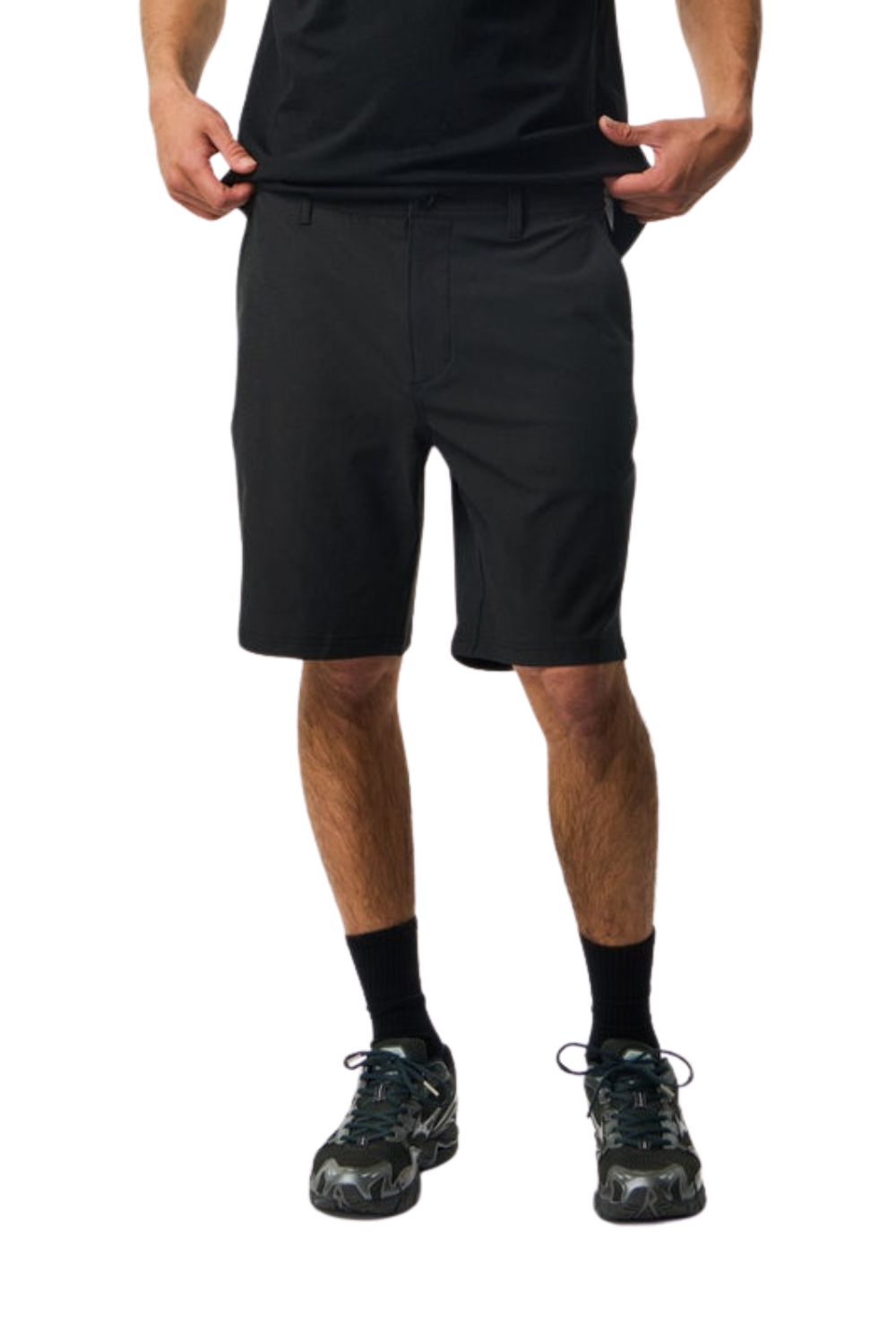 Person wearing black shorts on a white background