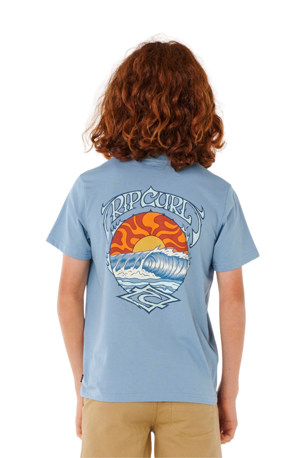 Boy wearing a light blue T-shirt with bold Rip Curl print on the back