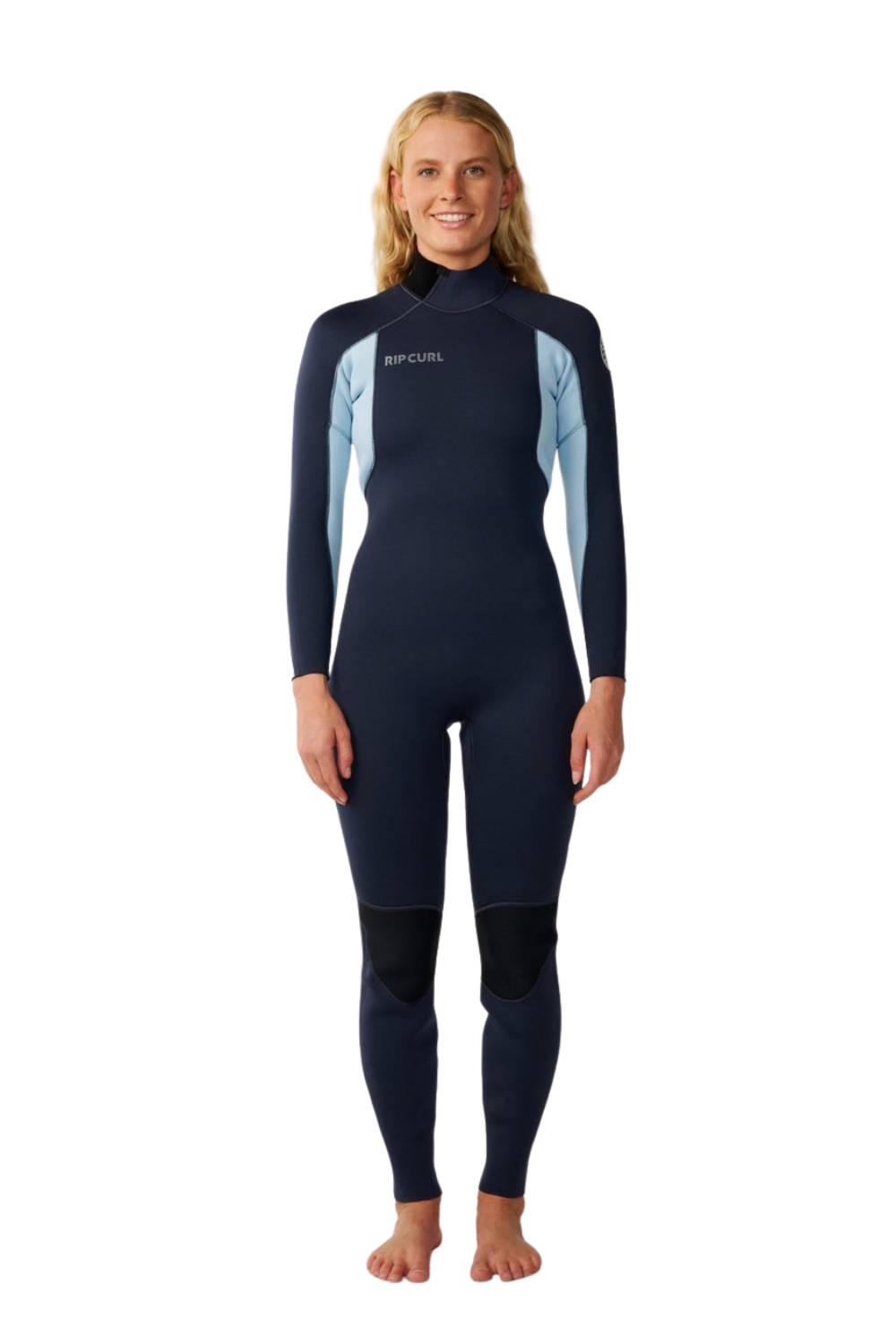A woman modeling a full-body wetsuit against a plain white background. The wetsuit is dark navy blue with light blue panels on the shoulders and upper arms, and black panels on the lower legs.