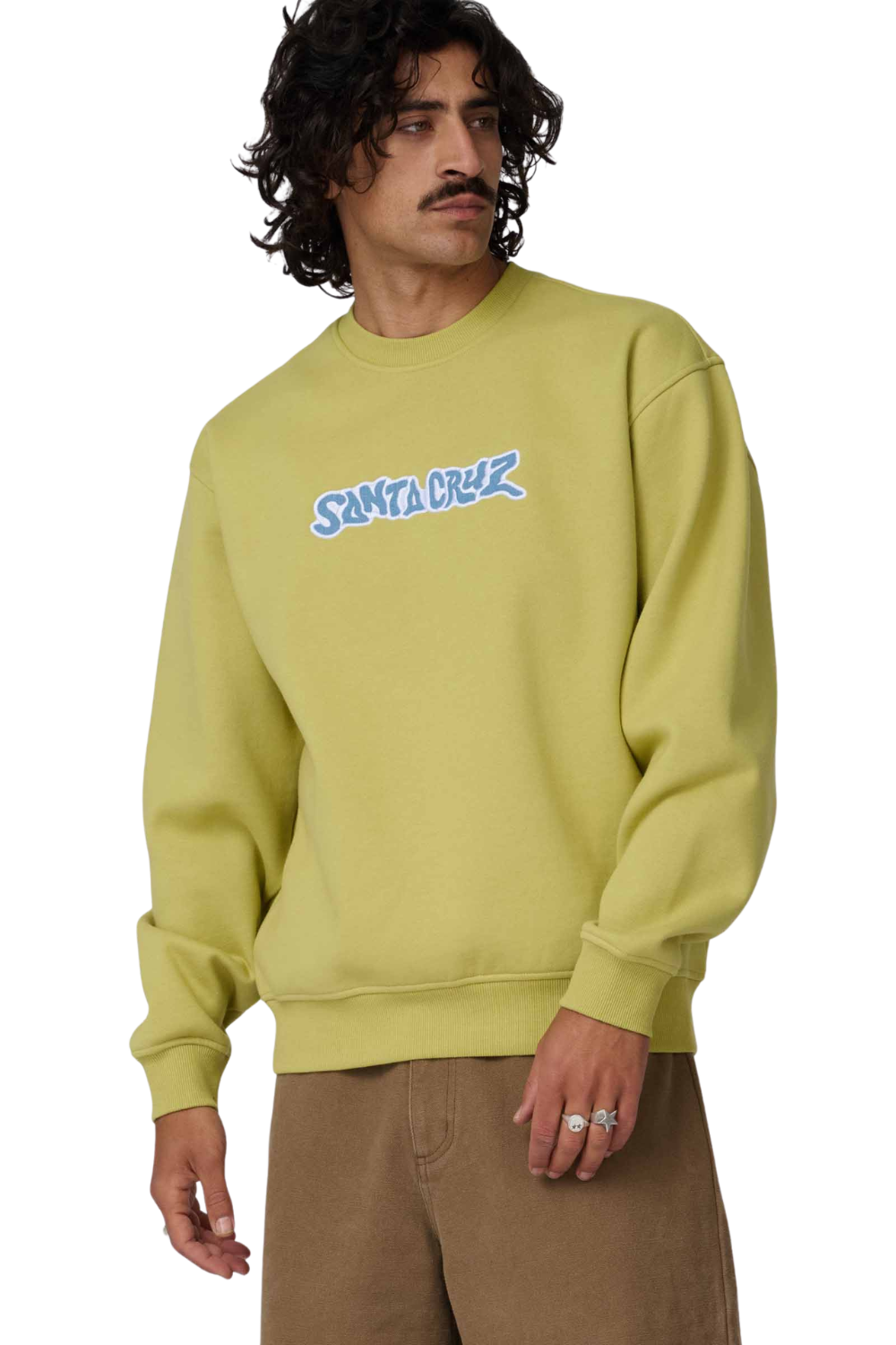 Man wearing a light green sweatshirt with 'Santa Cruz' logo on a white background