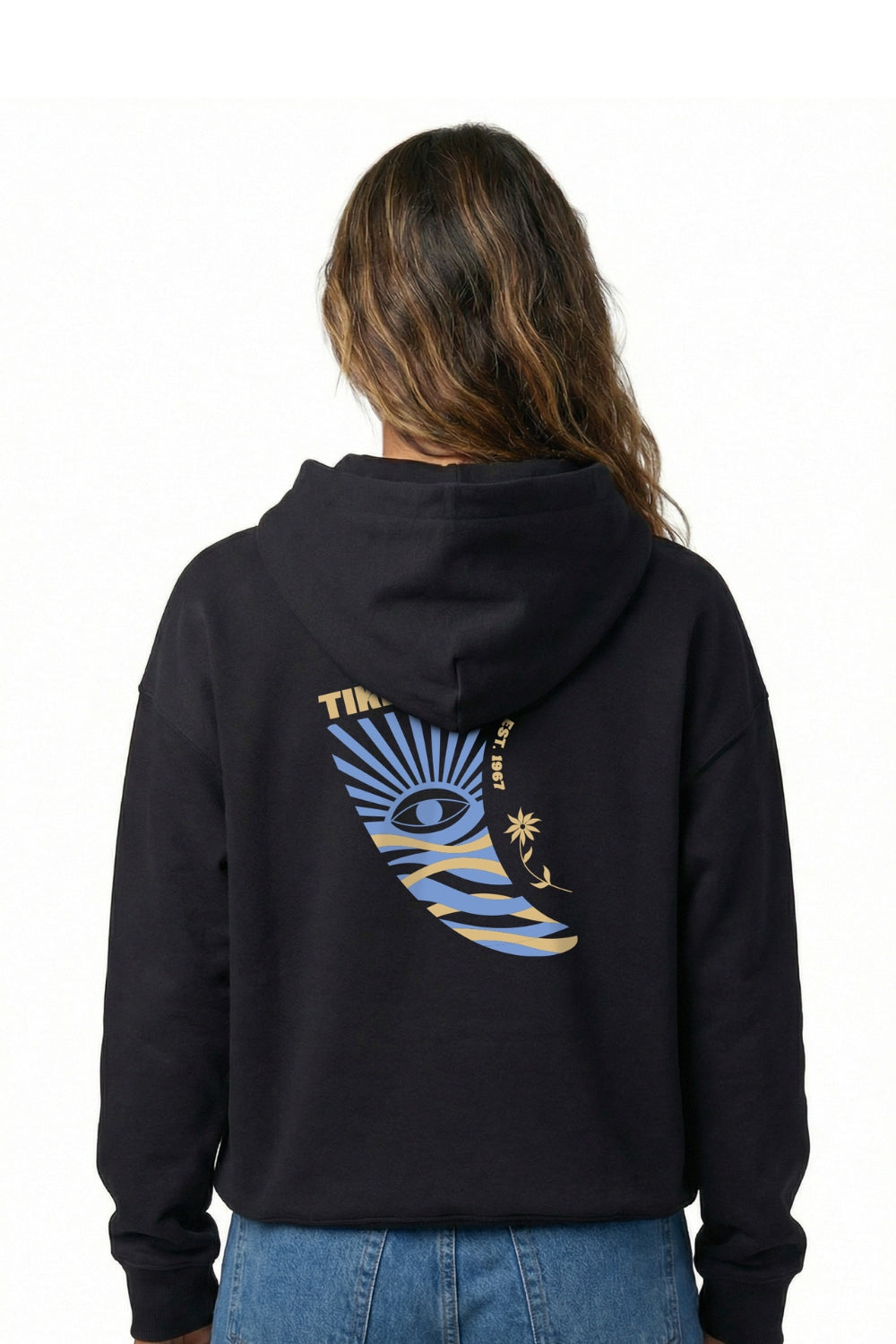 Person wearing a black hoodie with a colorful design on the back, standing against a white background