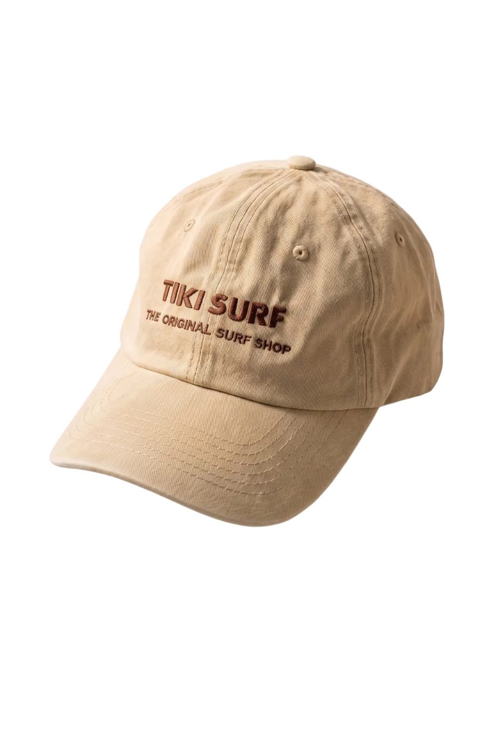 A beige baseball cap with 'TIKI SURF THE ORIGINAL SURF SHOP' embroidered in brown on the front, shown against a plain white background.