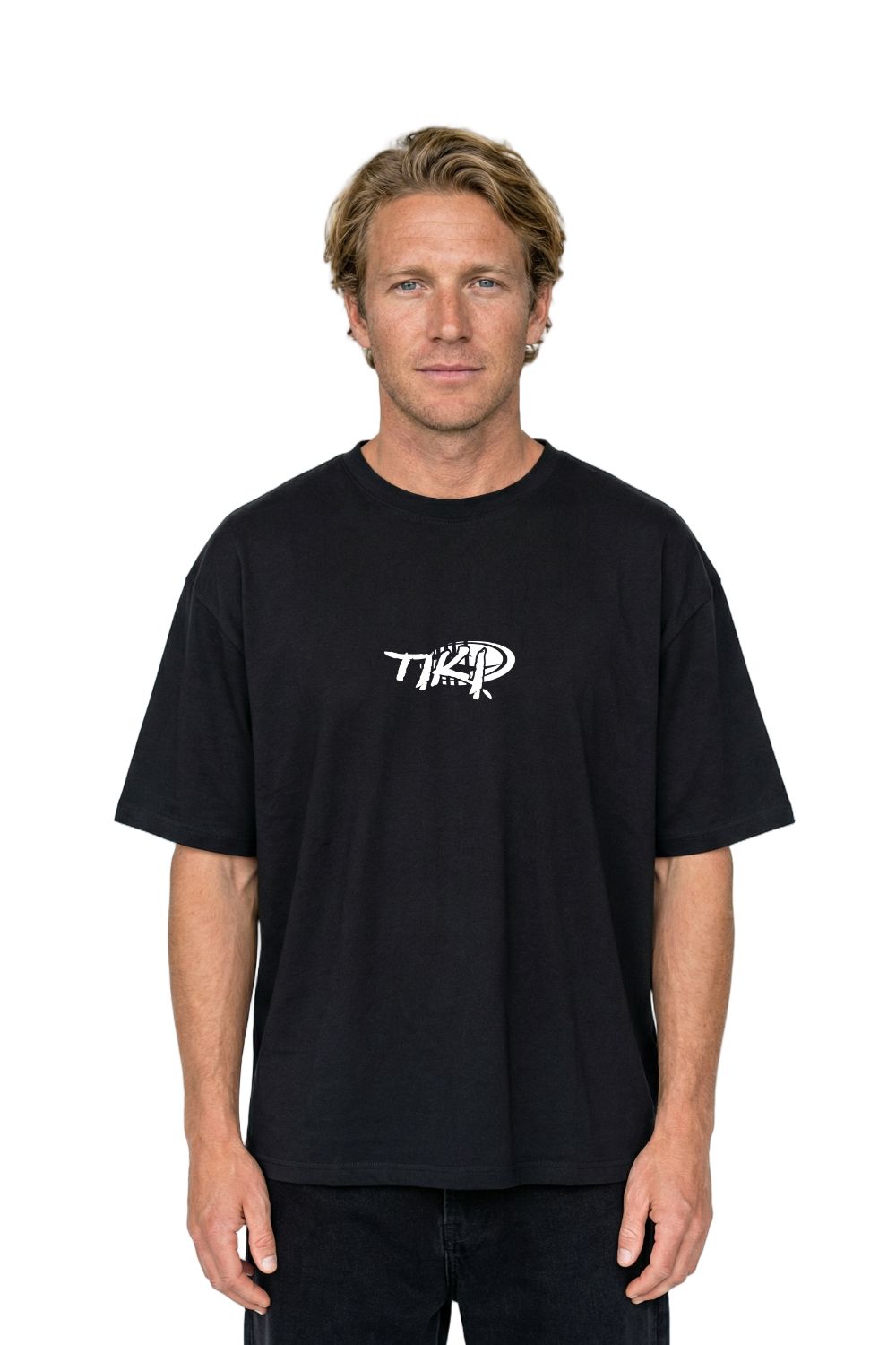 Man wearing a black t-shirt with a logo on a white background