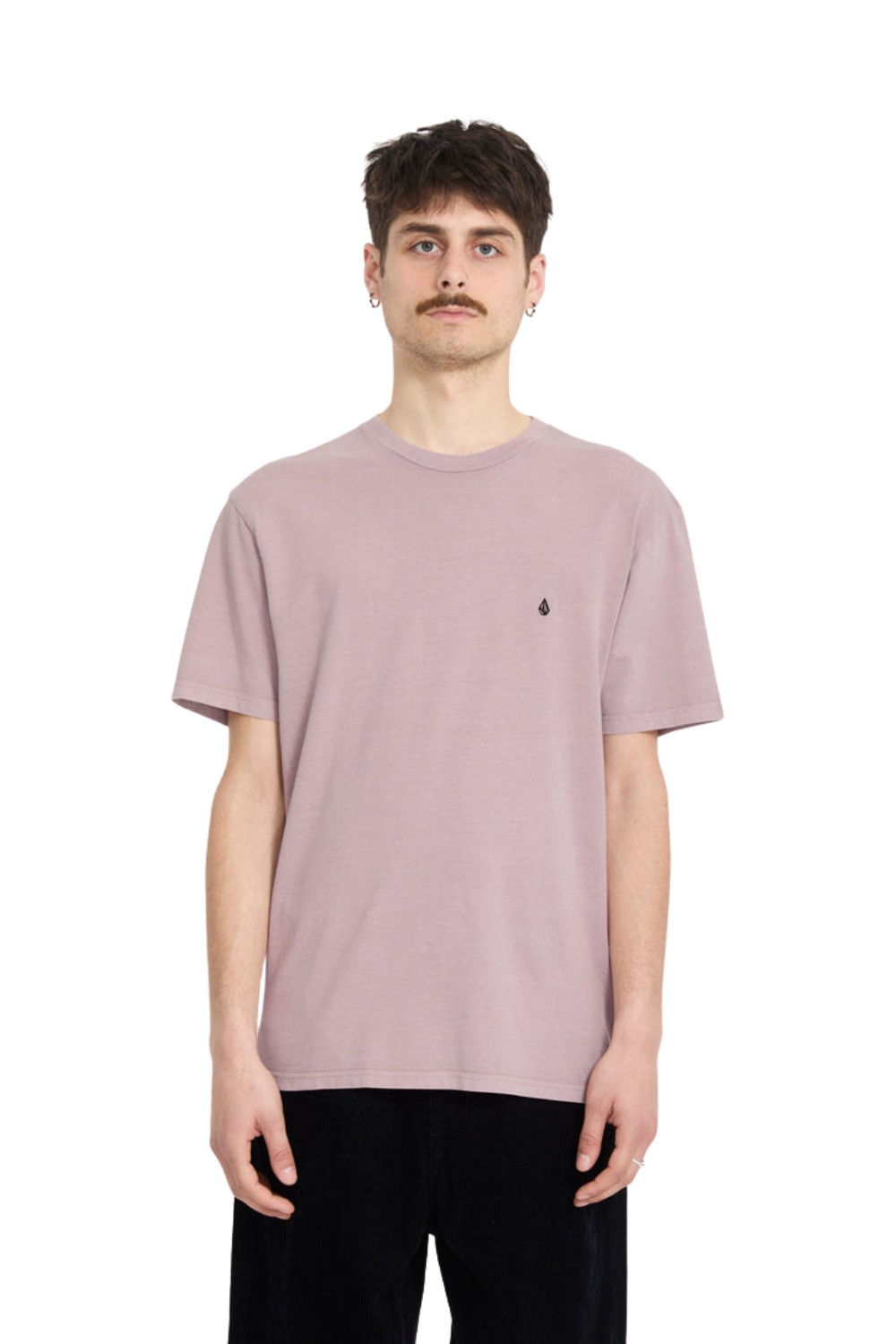 Person wearing a t-shirt in taupe with an embroidered Volcom stone logo