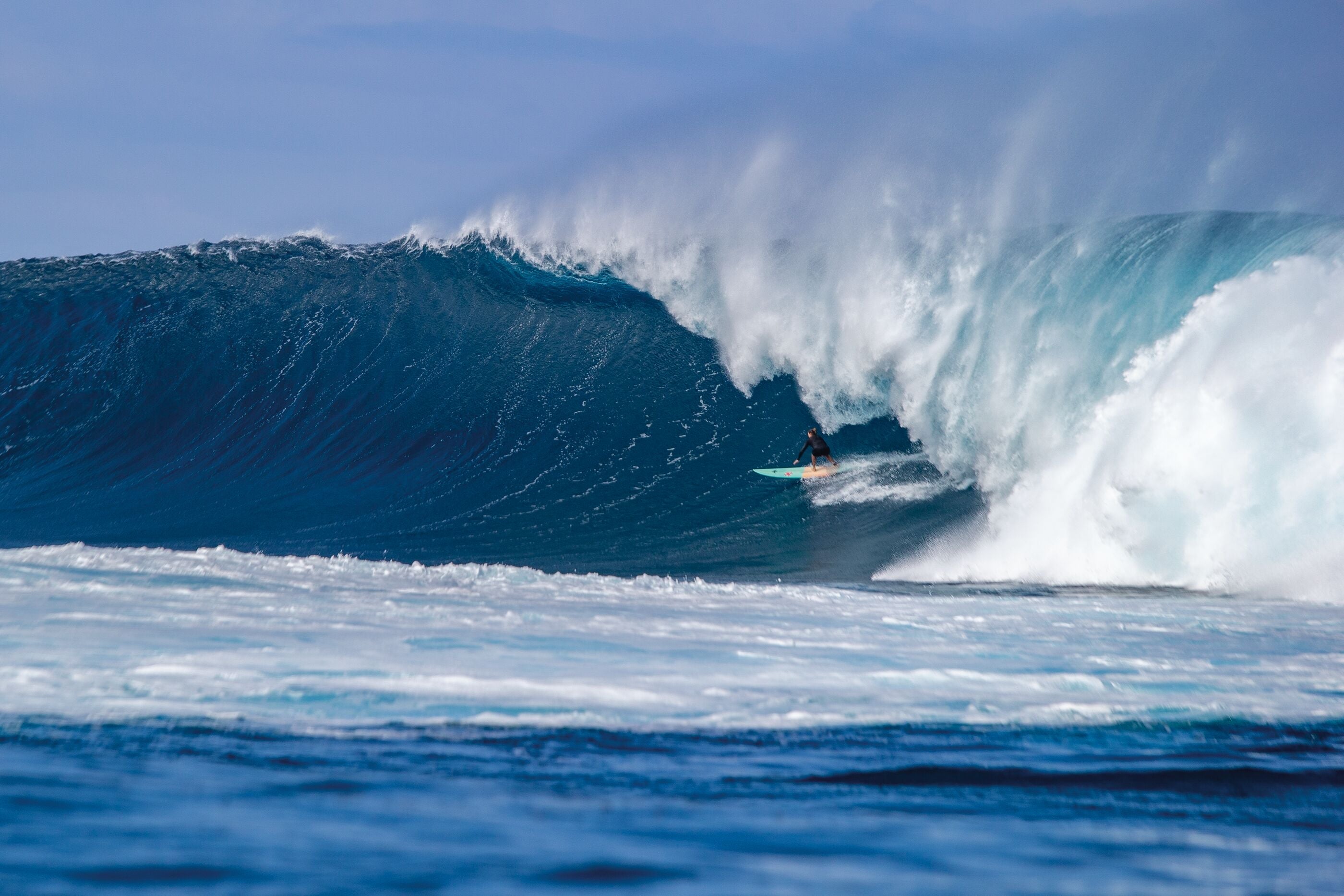 Surfer wearing patagonia wetsuit - on out Patagonia wetsuit page