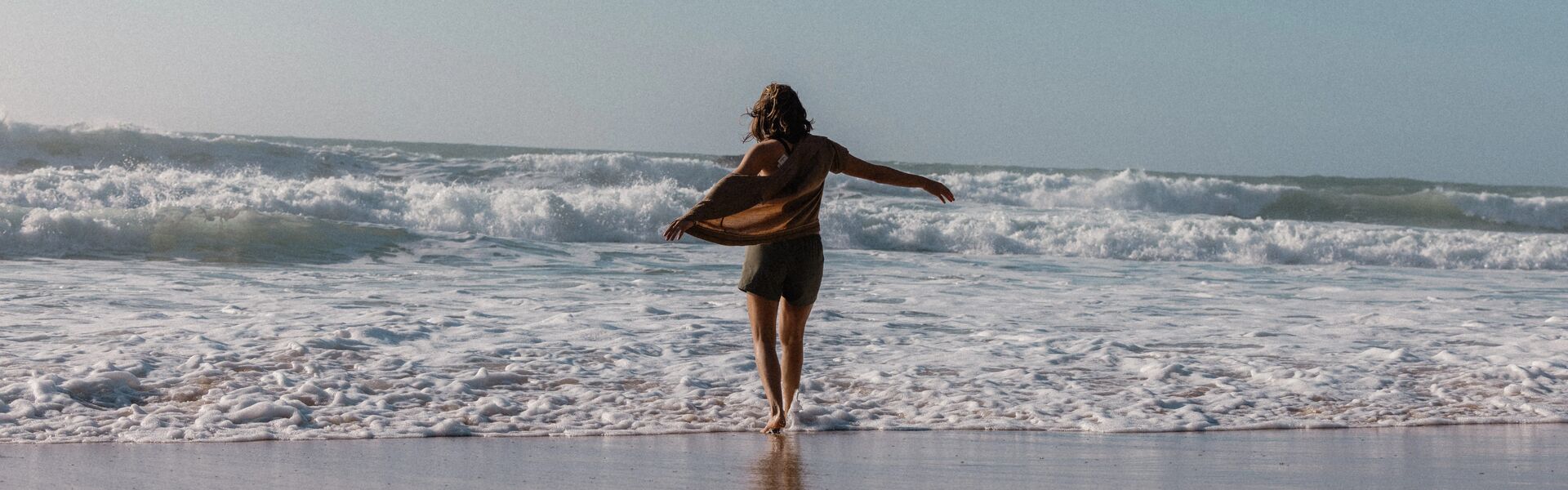     Womens surf clothing styled in a coastal lifestyle photoshoot featuring beach and summer apparel