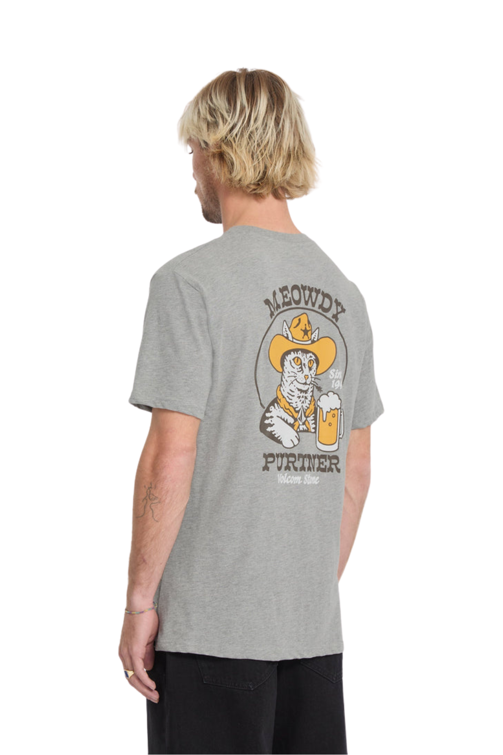 Person wearing a gray t-shirt with a graphic design on the back, standing against a white background