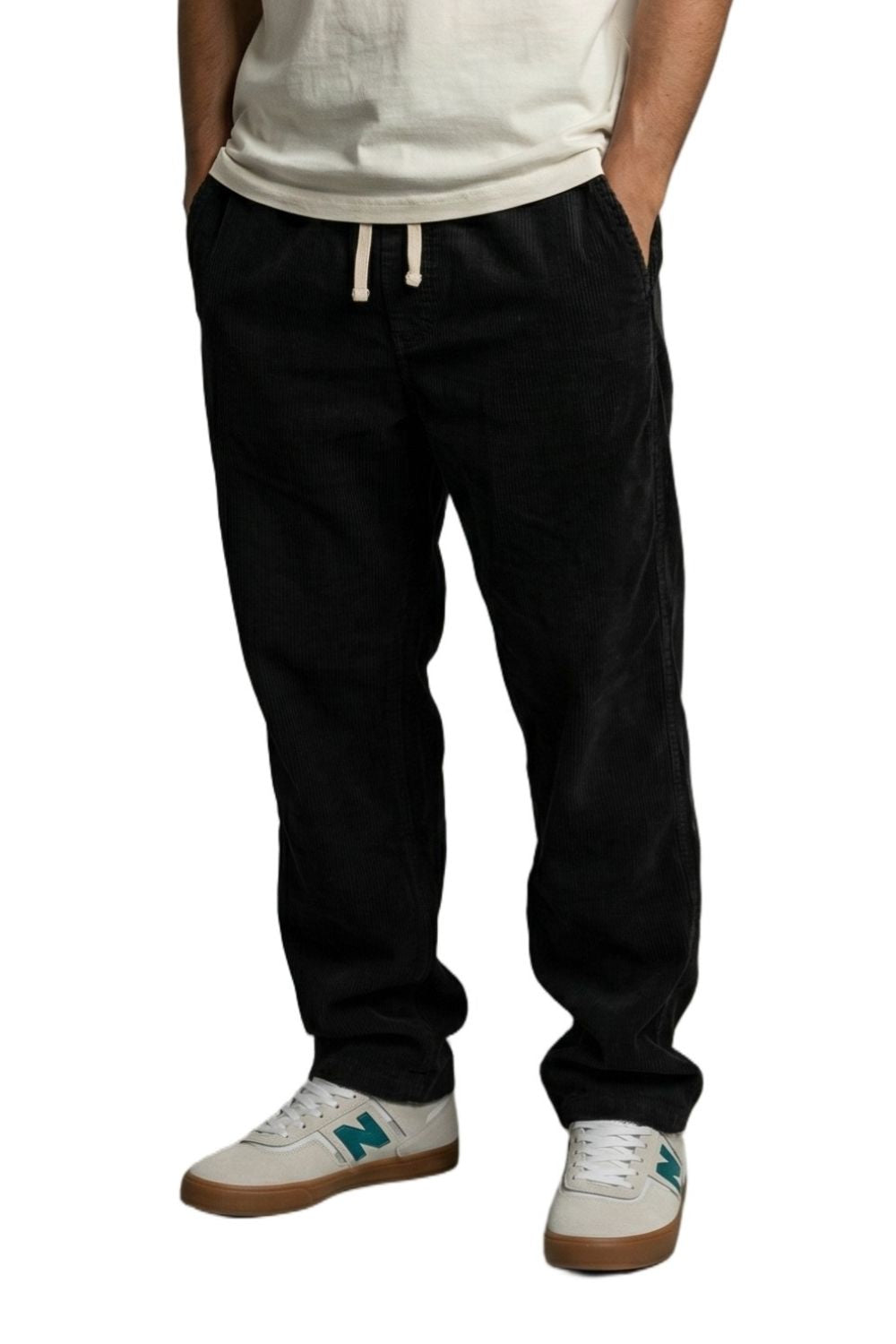 Person wearing black corduroy trousers 