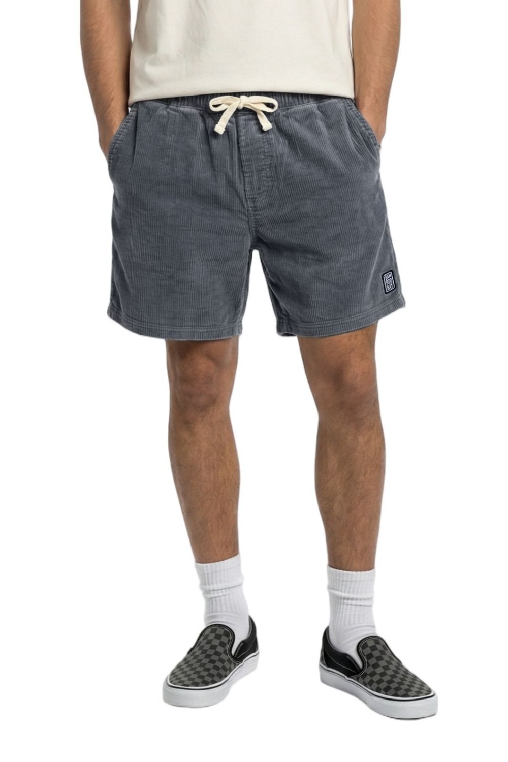 Person wearing a pair of navy corduroy shorts