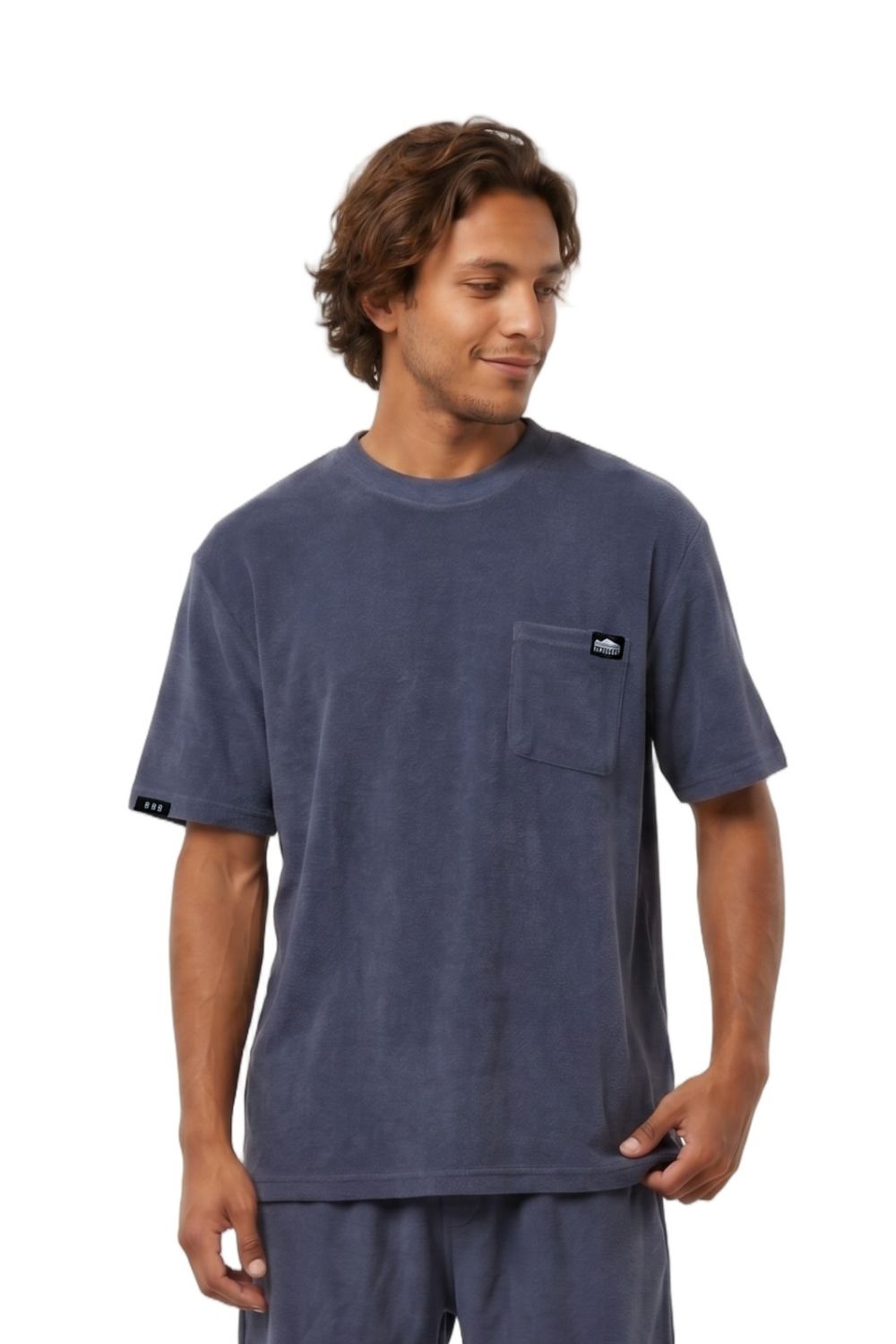 Man wearing a t-shirt with a chest pocket and logo in navy on a white background