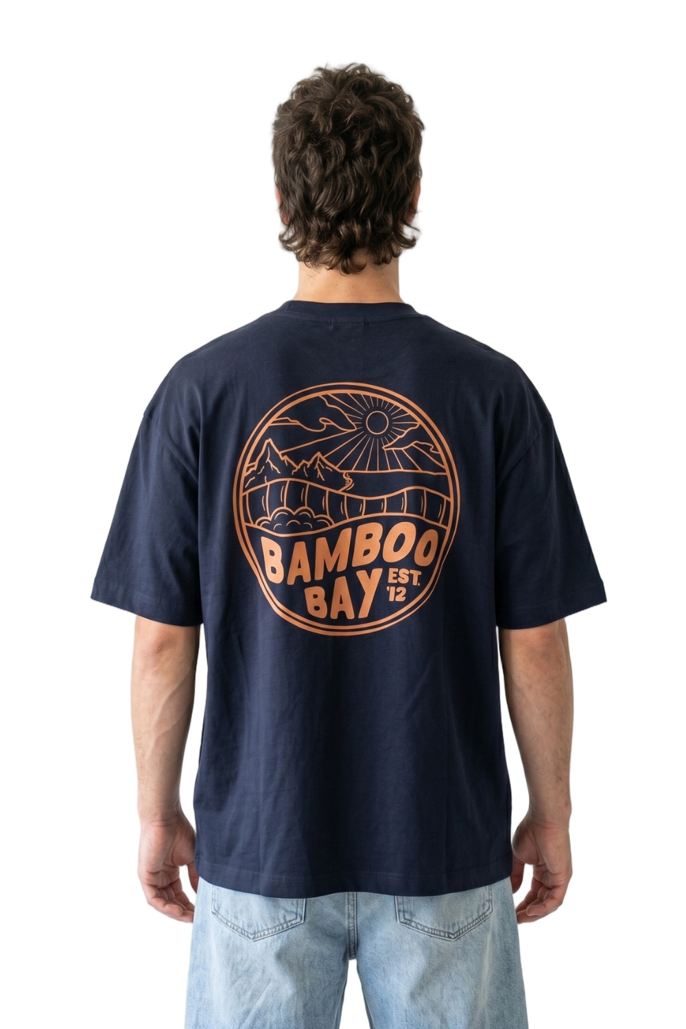 Person wearing a navy blue t-shirt with 'Bamboo Bay' logo on the back, standing against a white background