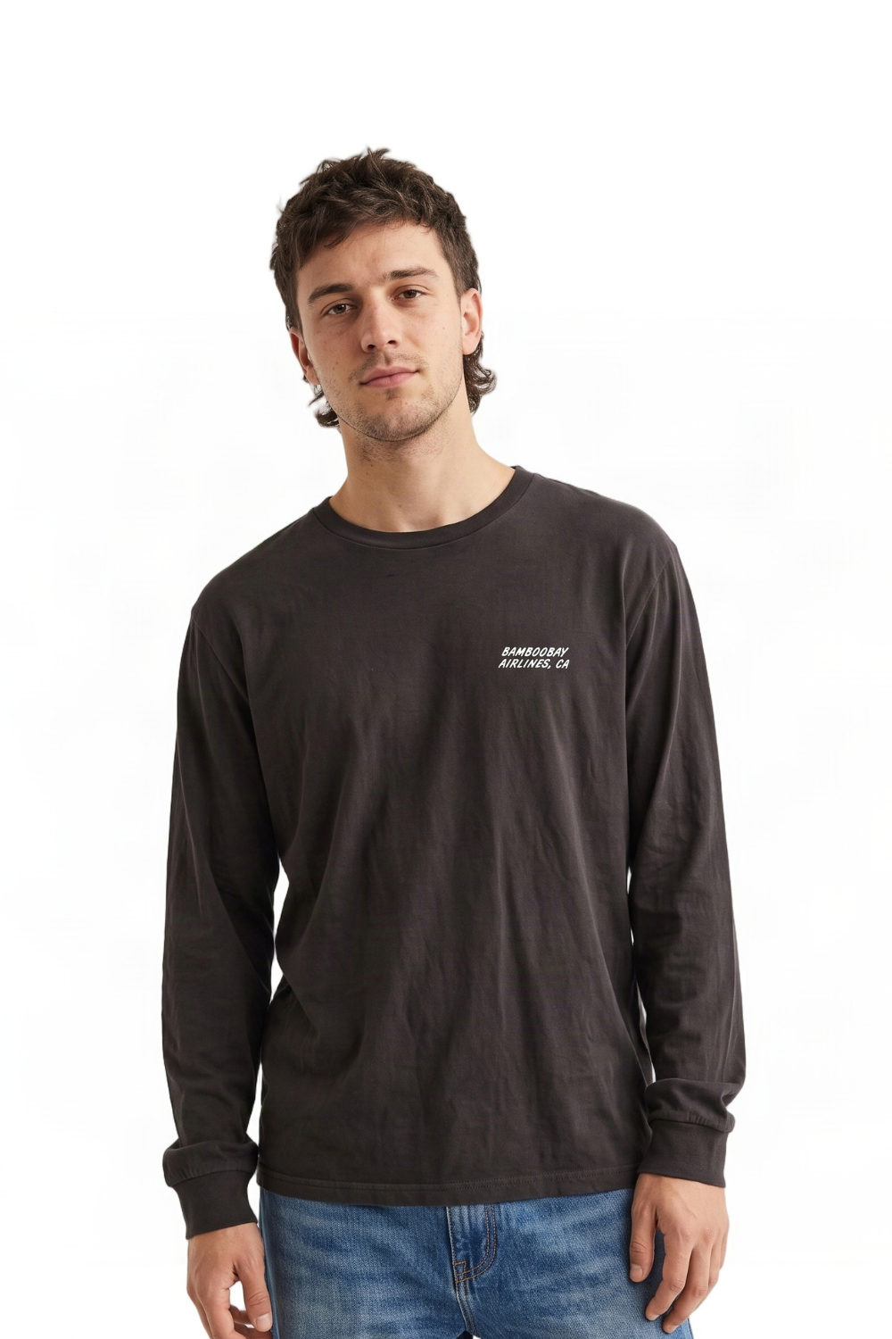 A man wearing a dark brown long-sleeve t-shirt with a small white 'BamBooBay, Airlines, CA' logo on the left chest, paired with blue jeans, against a plain white background.