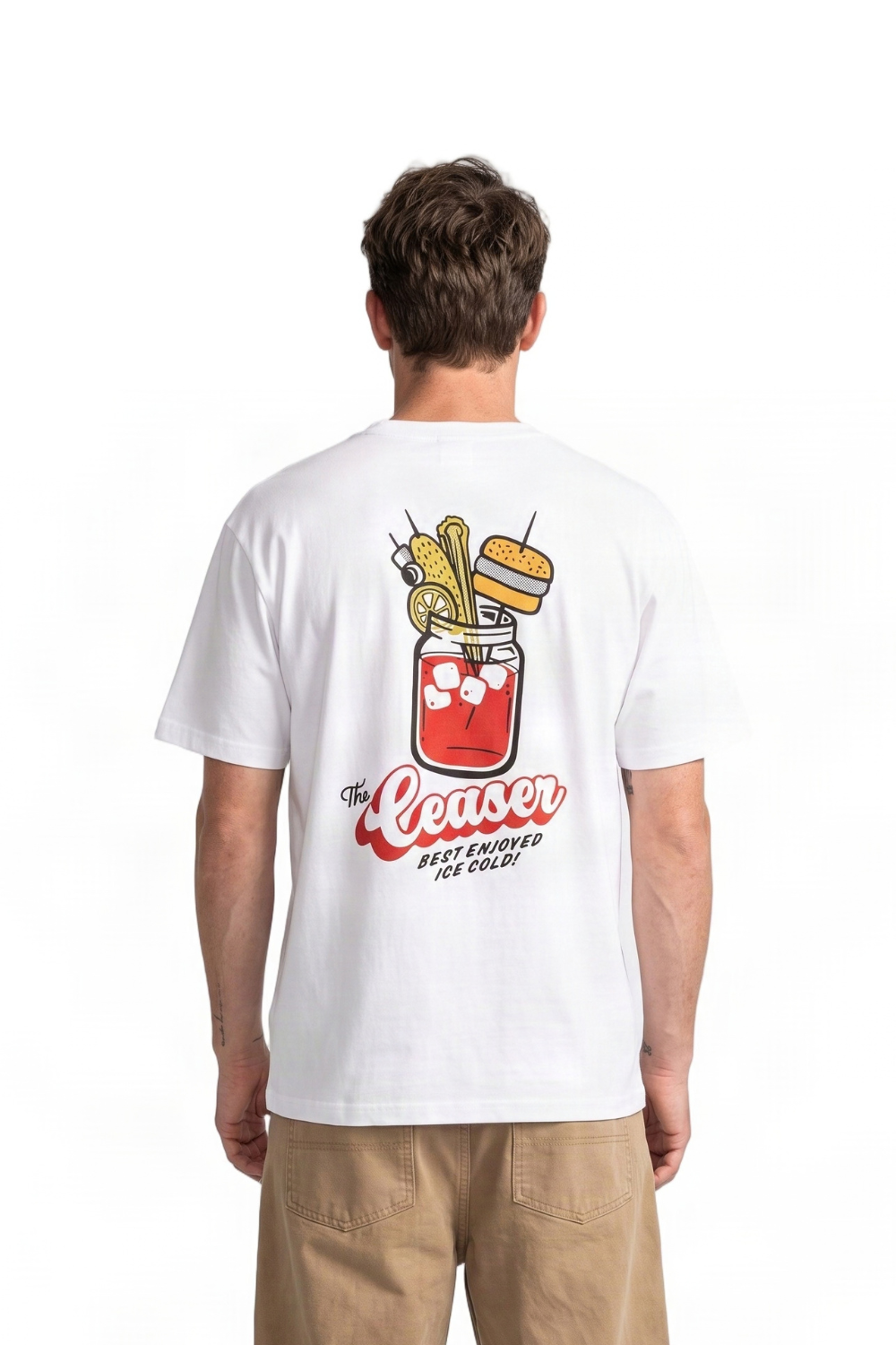 A man viewed from behind wearing a white t-shirt with a large graphic on the back. The graphic features a red mason jar cocktail, a burger, and the text 'The Ceaser Best Enjoyed Ice Cold!'.