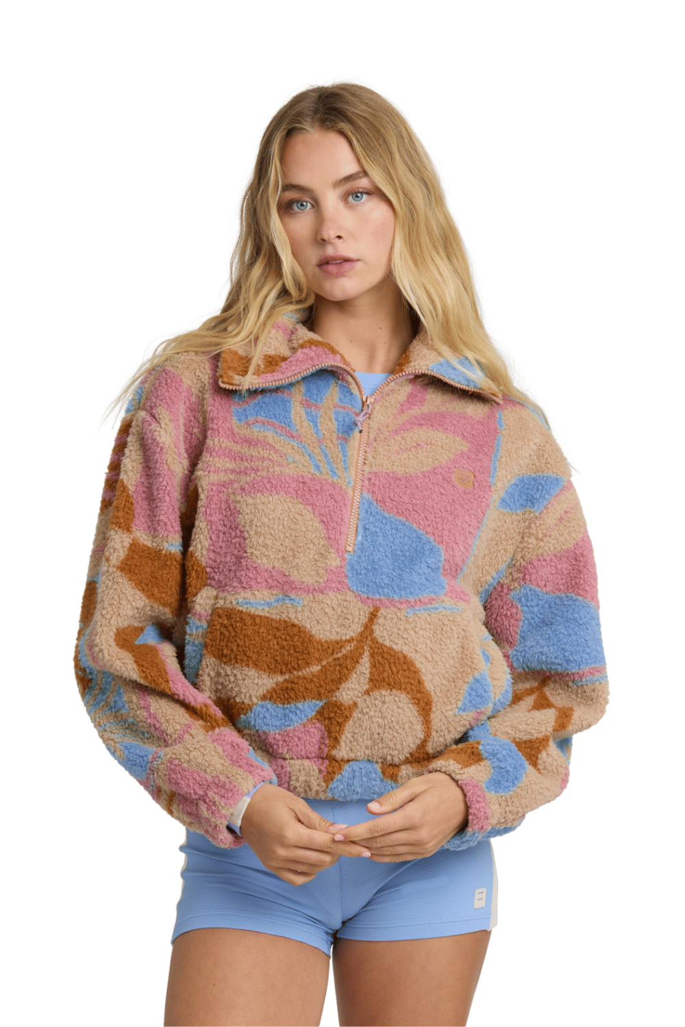 Woman wearing a colorful patterned jacket on a white background