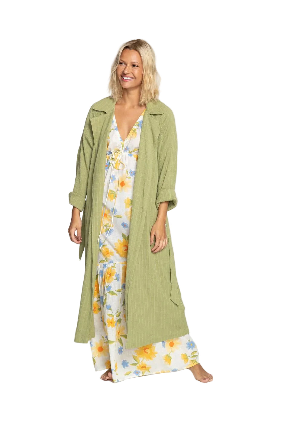A female model wearing an avocado green Billabong My Babe jacket with a collar neck, long sleeves, and a maxi length. The jacket features welt pockets and there is a removable belt visible.