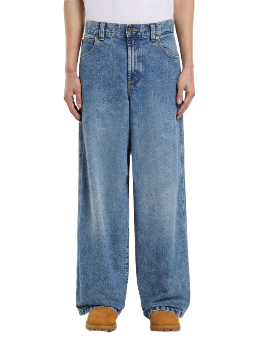 A pair of Dickies Loose Wave Denim Jeans in rinsed blue with a fade, displayed on a model facing forward.