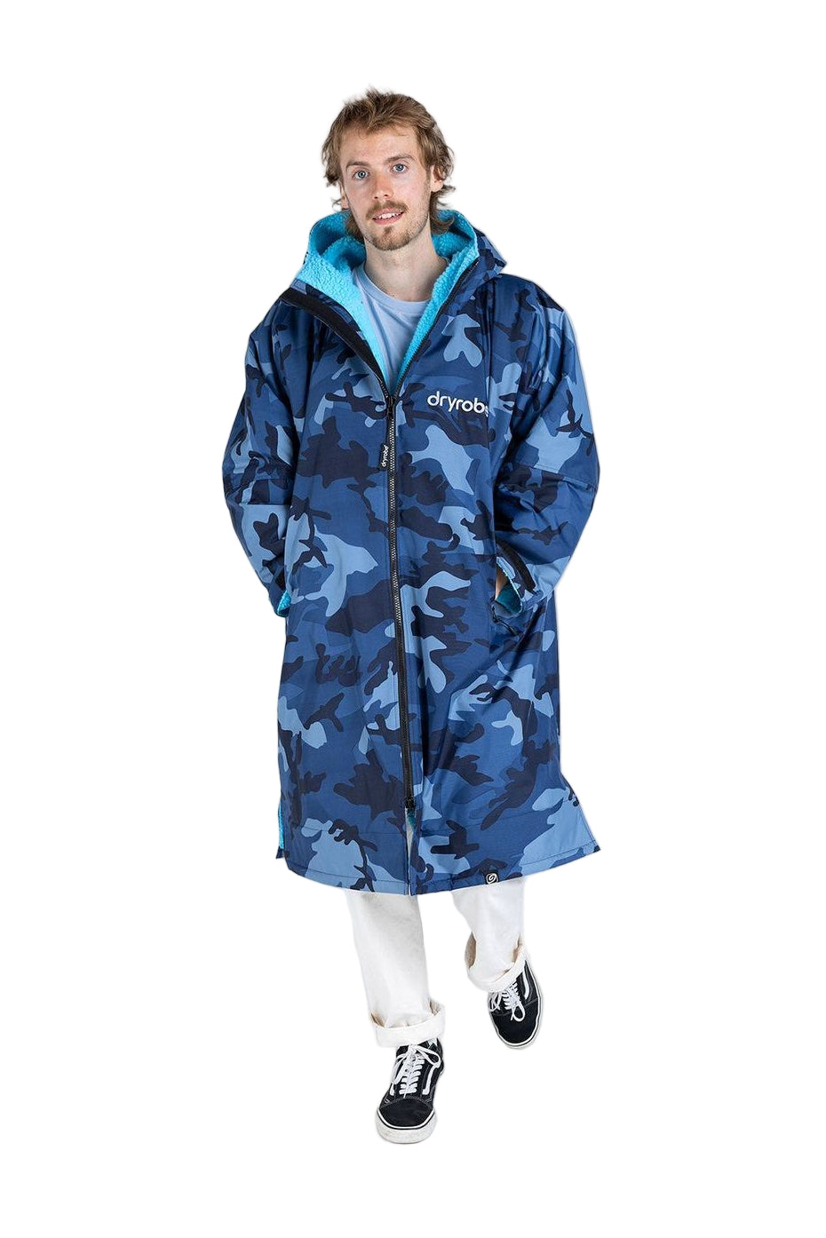 Person wearing a blue camouflage changing robe with 'Dryrobe' branding on a white background