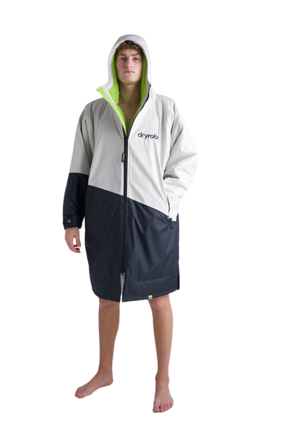 Person wearing a white and black changing robe with a hood on a white background