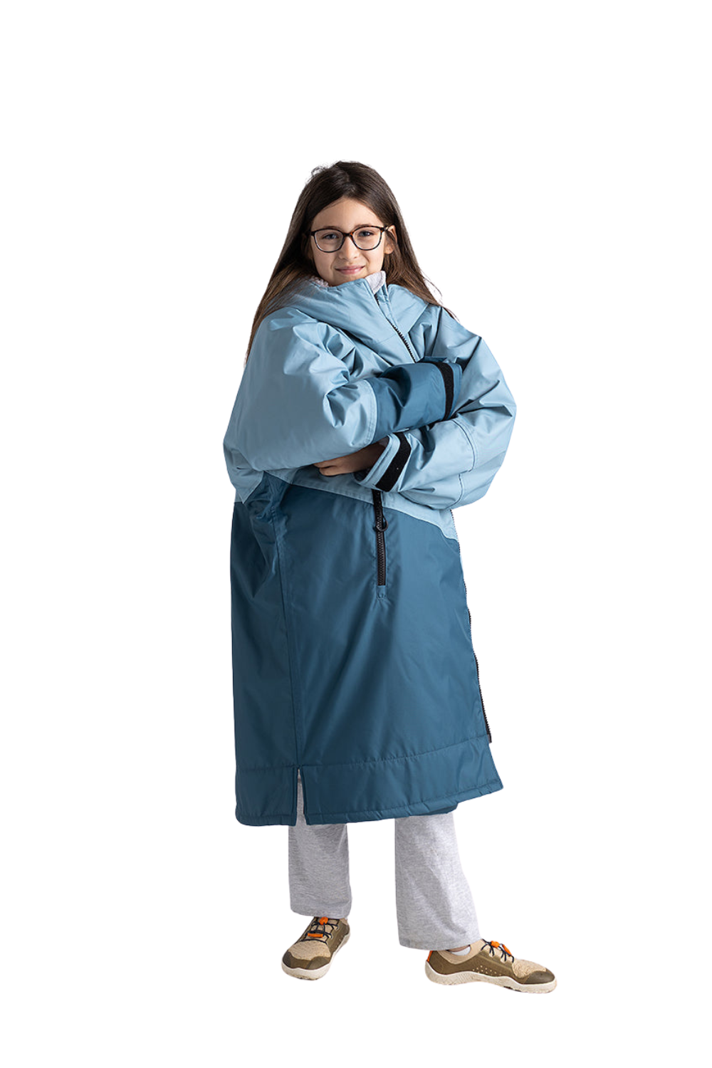 Person wearing a blue Dryrobe/changing robe on a white background