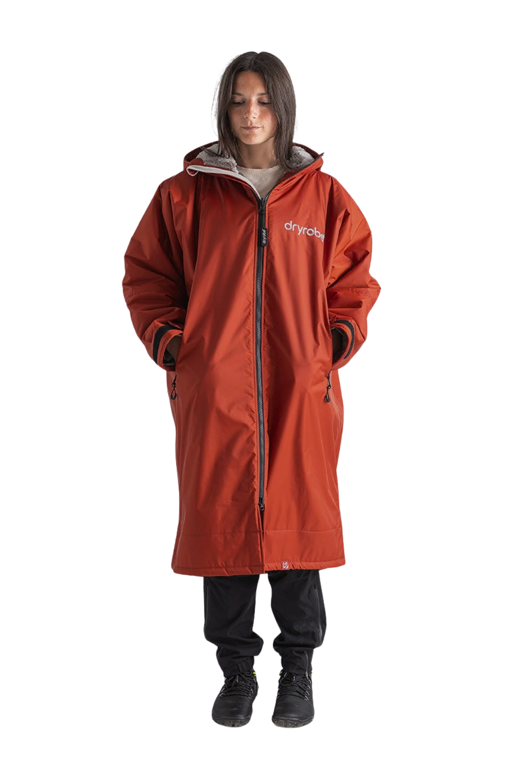 Model wearing a Dryrobe in a burnt orange colour