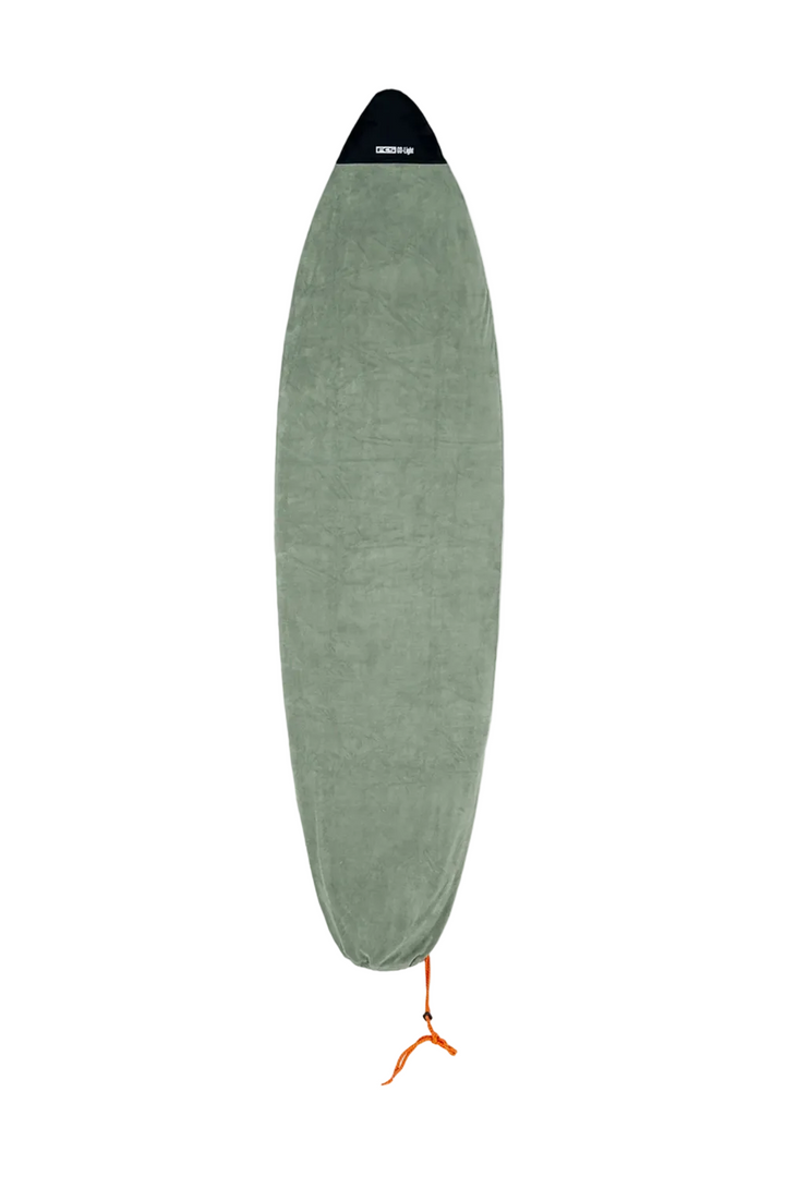 A FCS Packable Surfboard Stretch Cover in a light sage colour on a white background