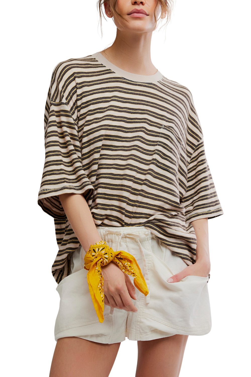 Woman wearing a striped shirt and white shorts with a yellow bandana, on a white background