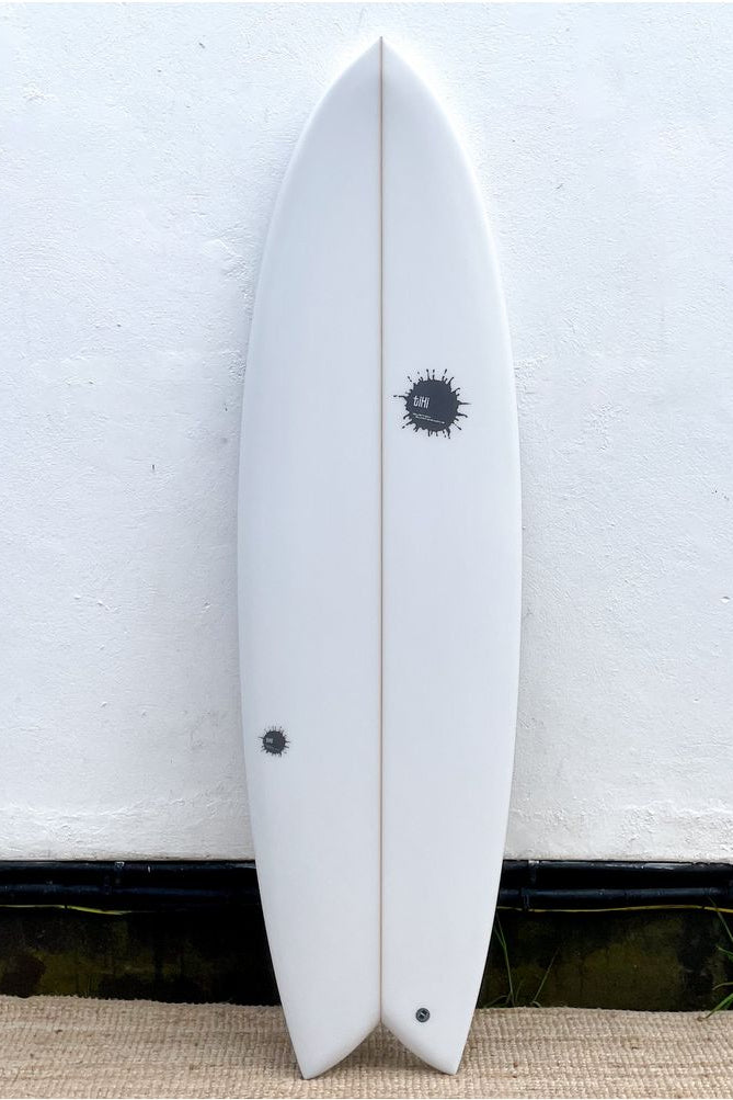 Image of Tiki Custom Surfboard - 6'2 Parrot Twin - Clear from the front