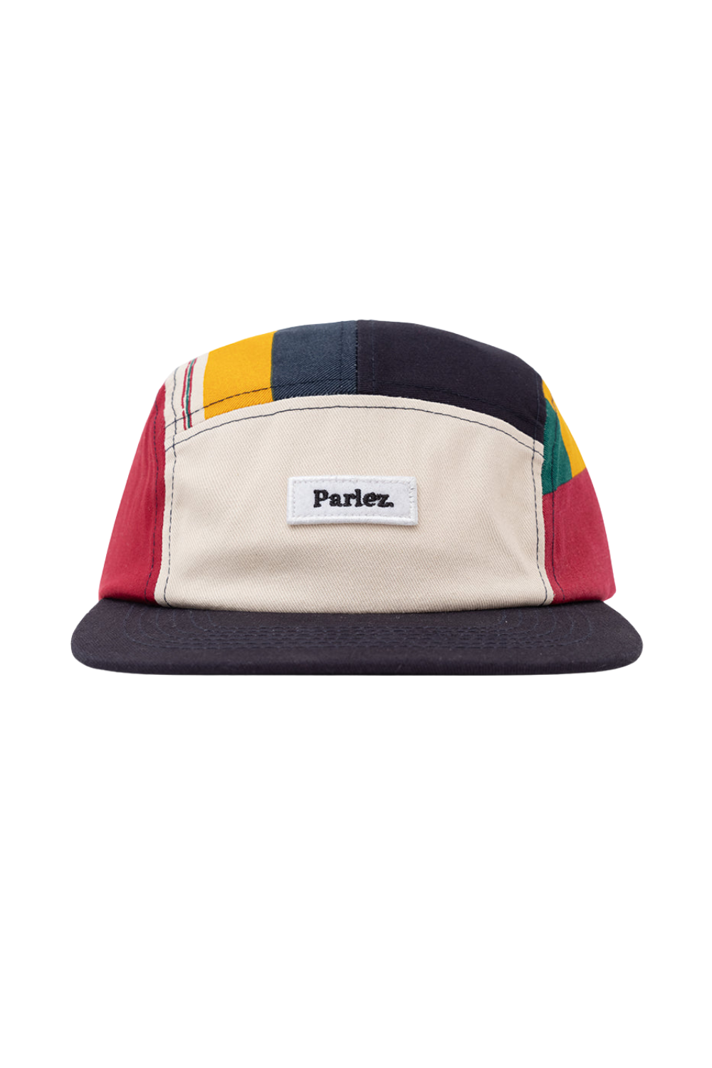 A Parlez brand 5-panel camp cap with a color-blocked design featuring a cream front panel, dark navy brim and side panels, red side panels, yellow and blue panels on the top, and green on the far side.